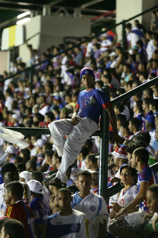 the crowd of people is watching and smiling