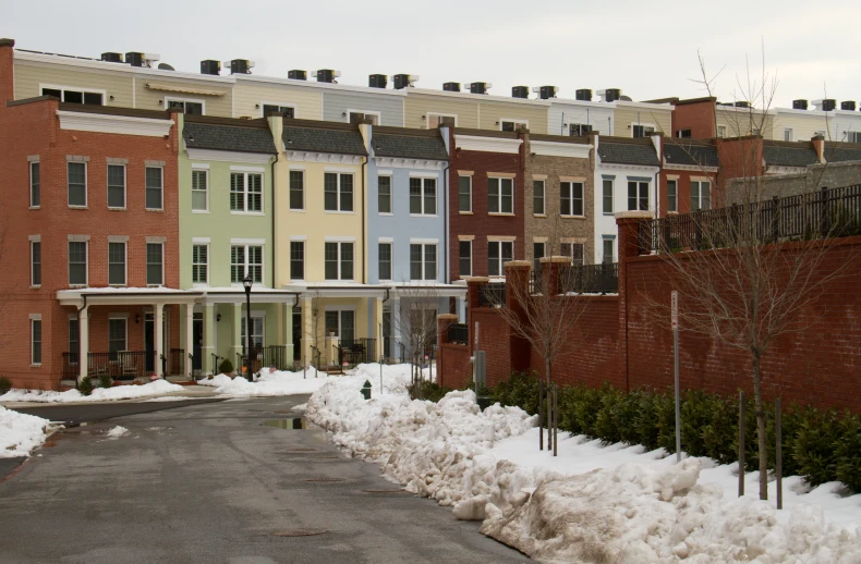 several different townhouses lined up next to each other