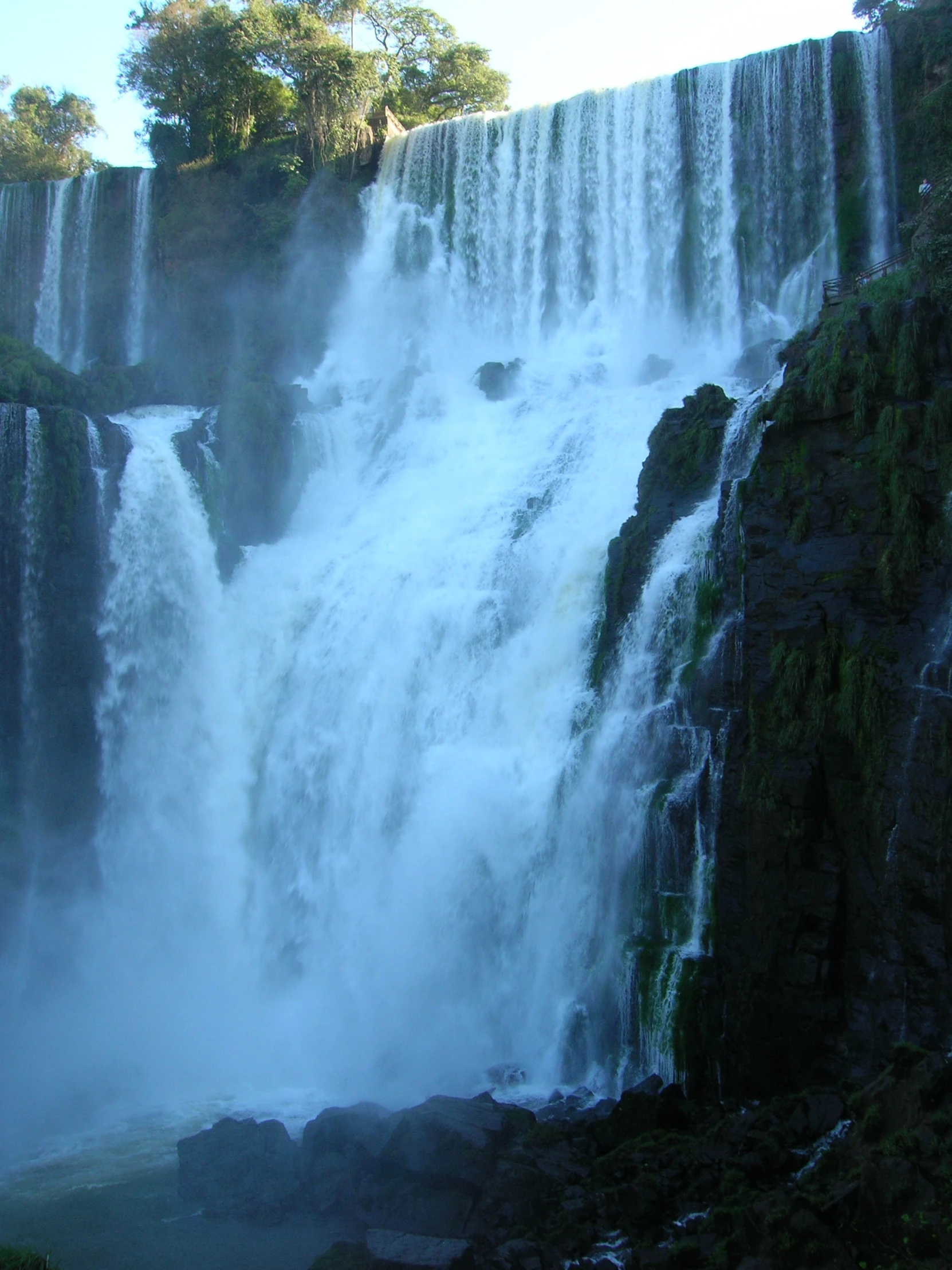 view of water falling from a tall waterfall