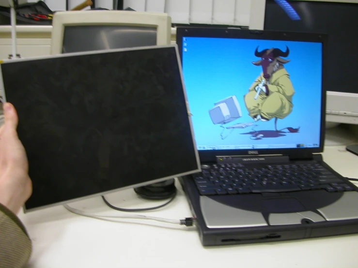 a laptop and desktop computer, each showing an animated image