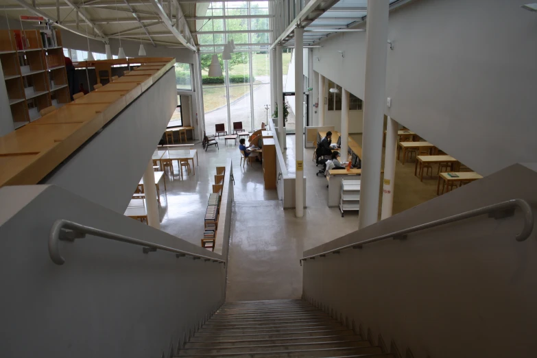 two people sitting in a liry inside a modern building