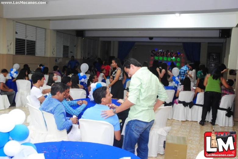 a man is dancing with his guests at an event