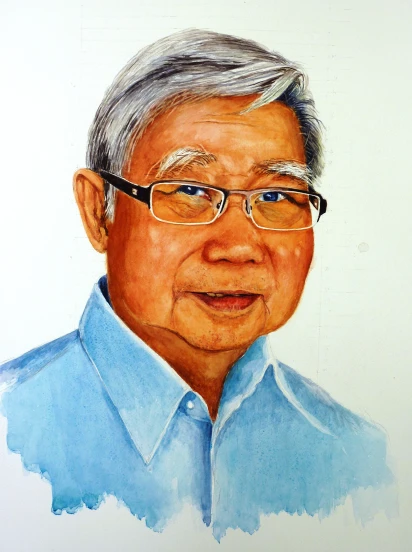 an elderly man in a blue shirt and glasses