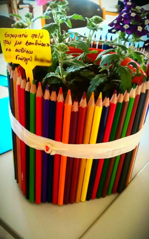 a large metal basket filled with lots of pencils