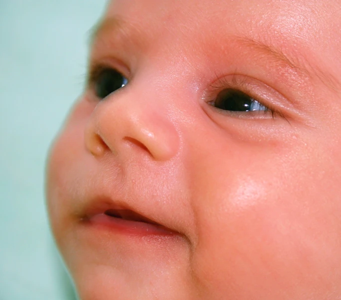 baby looking up at soing outside the window