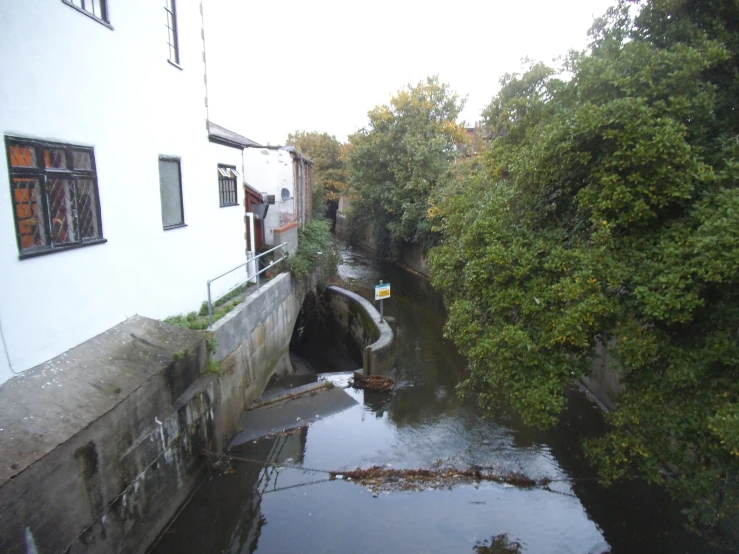 a small waterway in a city with a building