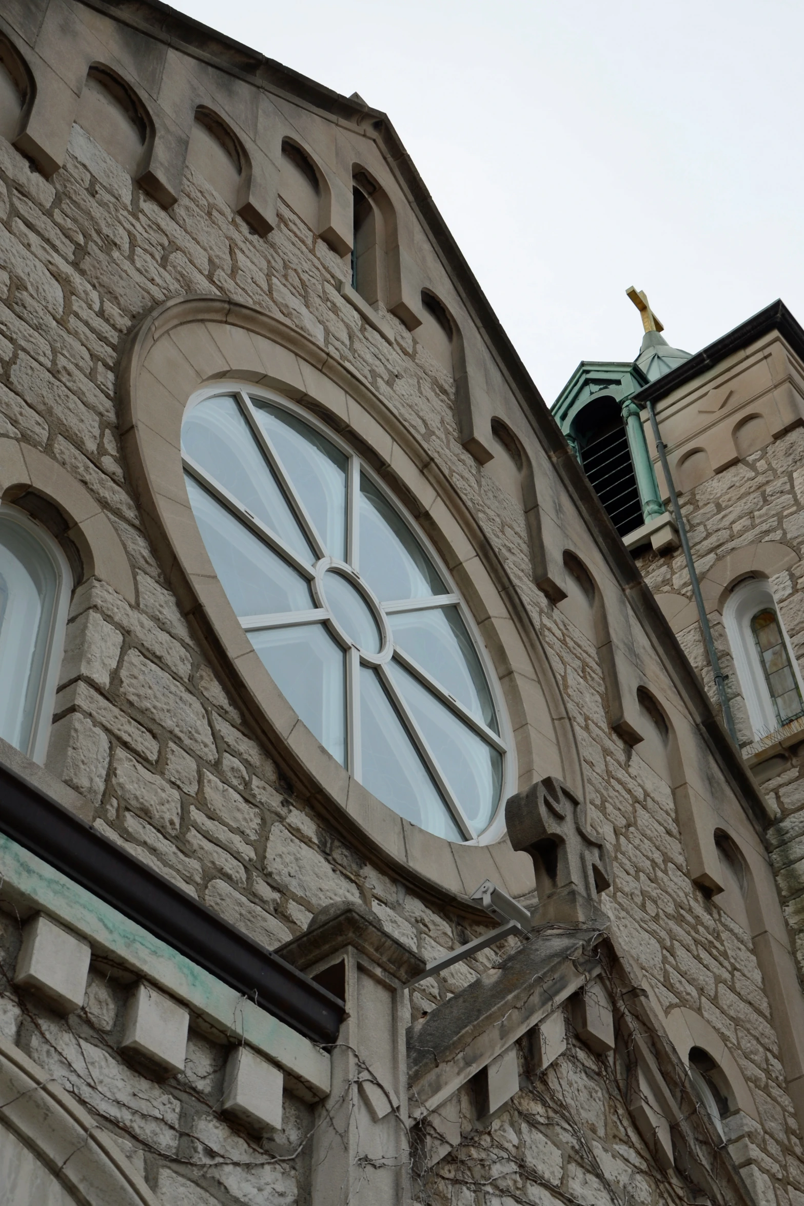 the top of a tall building with arched windows