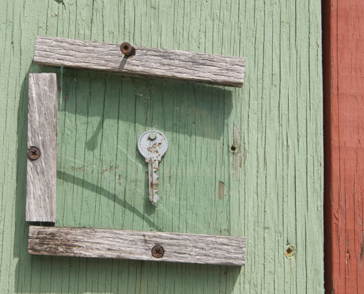 a key is set into the wooden frame