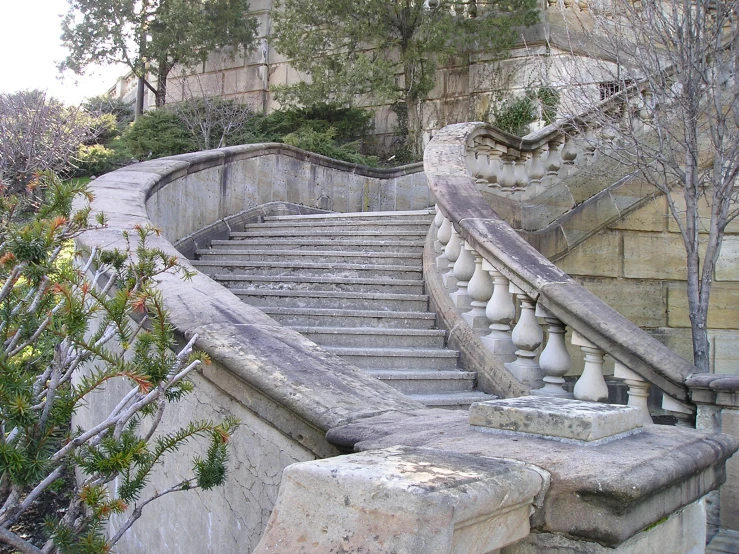 a very ornate staircase with handrails to the side