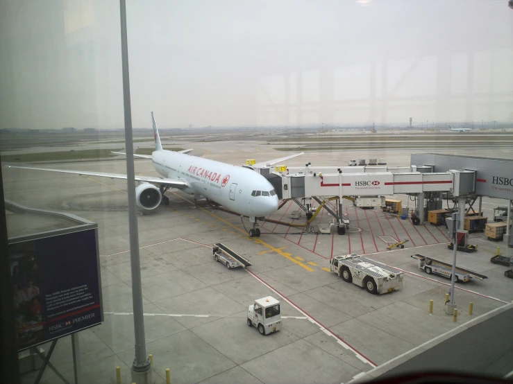 an airport terminal with a white plane at the gate