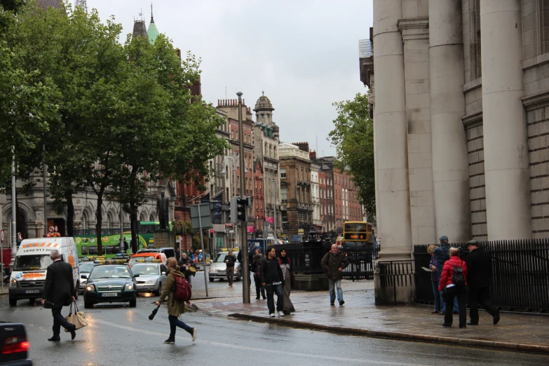 people on the street in rainy weather in the city