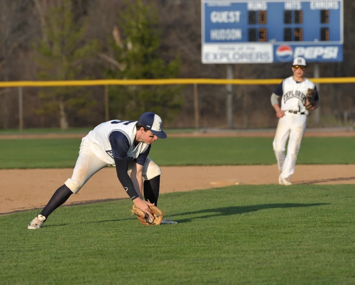 a couple of baseball players are playing baseball