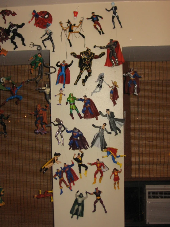 a group of figures is hung on the wall of a room