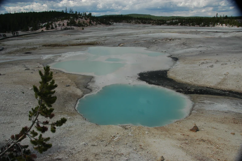 three lakes of blue in an open field