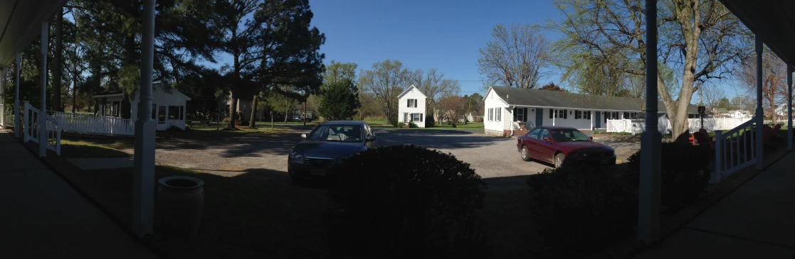 a car is driving in front of the house