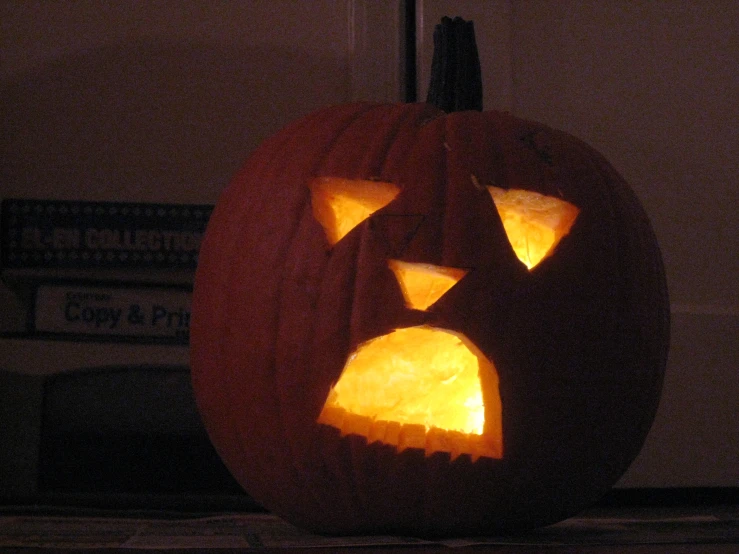 the face of a pumpkin carved into an owl