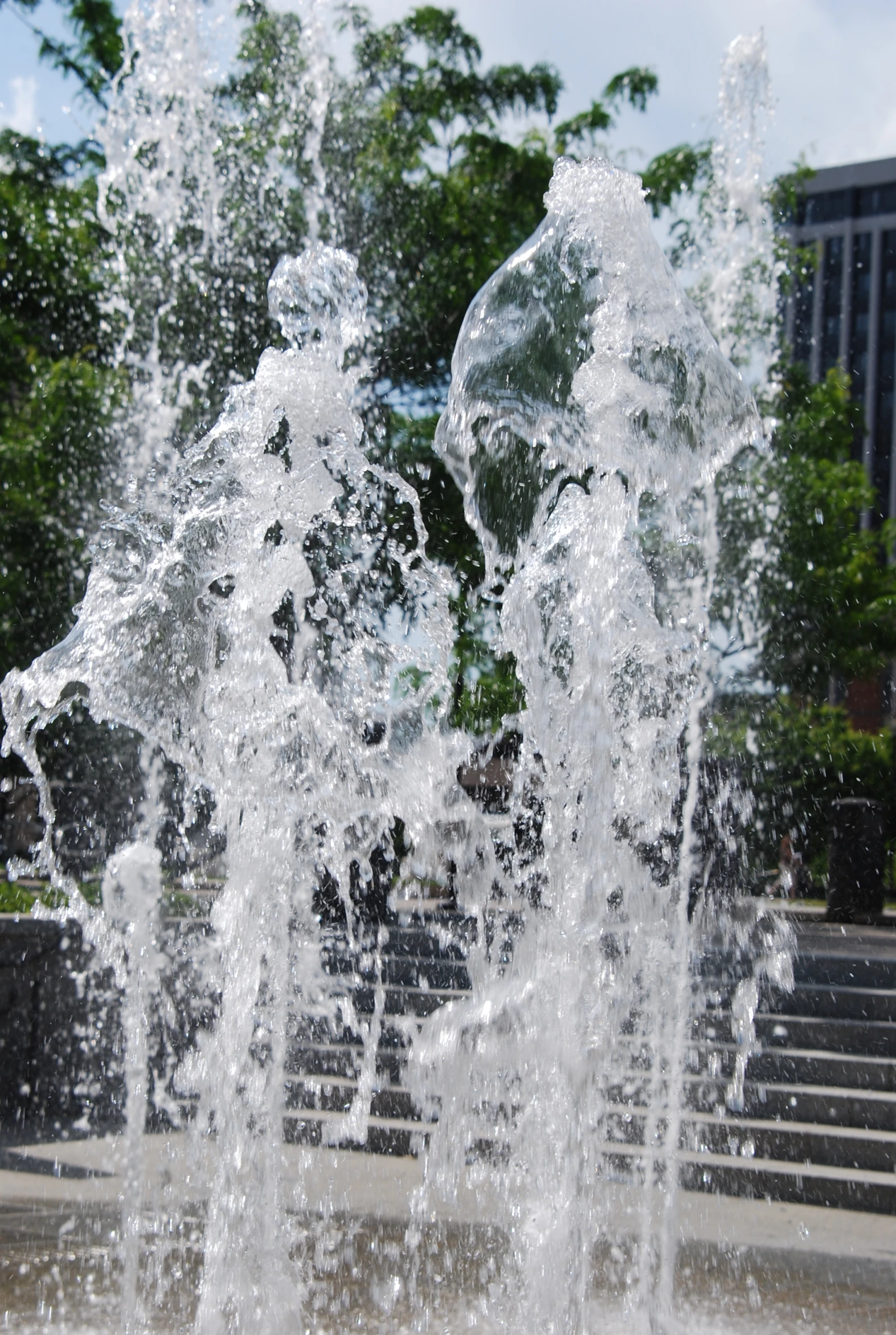 water splashes out from the side of a fountain