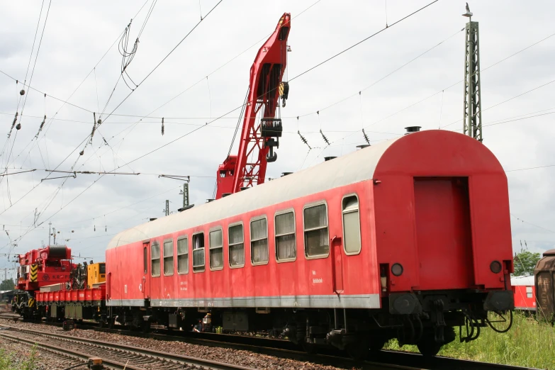 a train is driving past some power lines