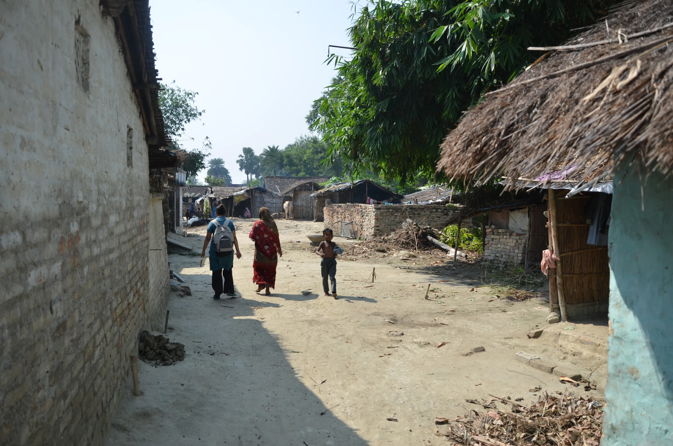 a person that is walking next to a house