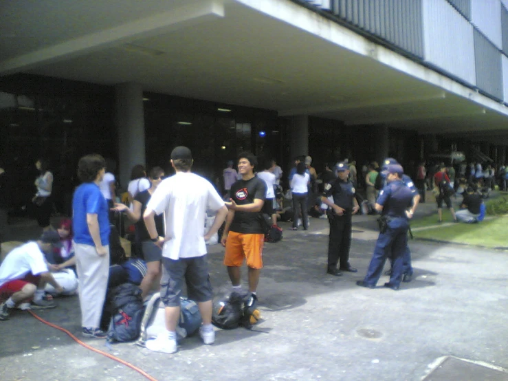 a large group of people standing in a street