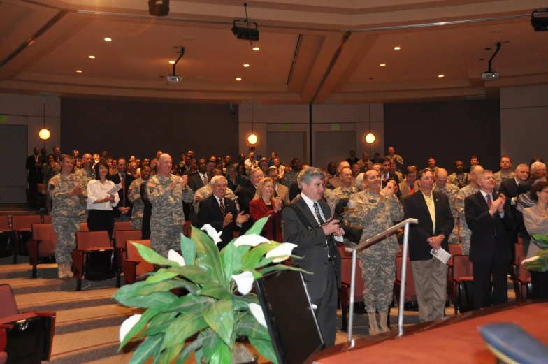 a group of men and women wearing uniforms standing around