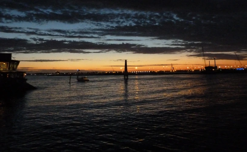 a ship is seen in the dark water