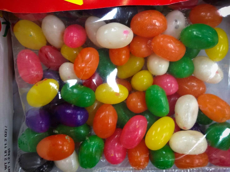 some candy beans inside of a cello bag