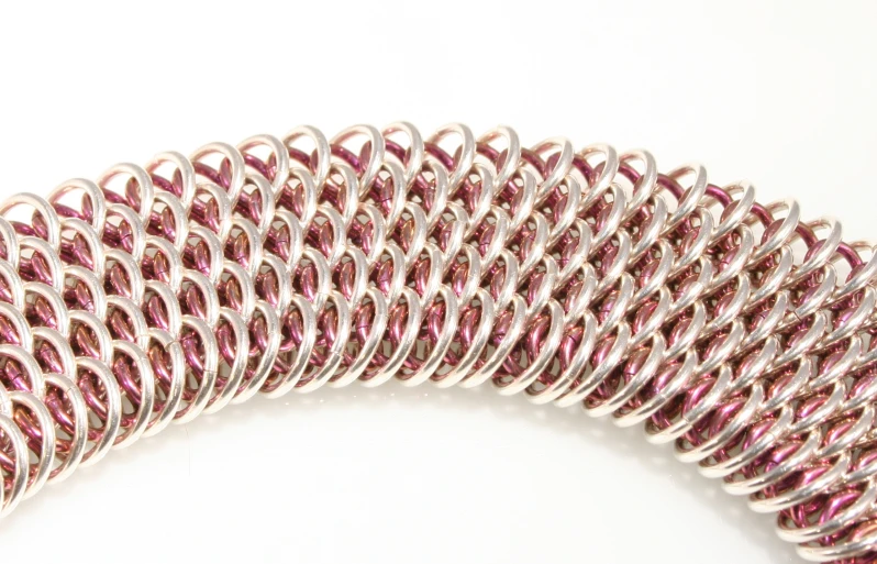 a close up of an intricate coil design on a white background