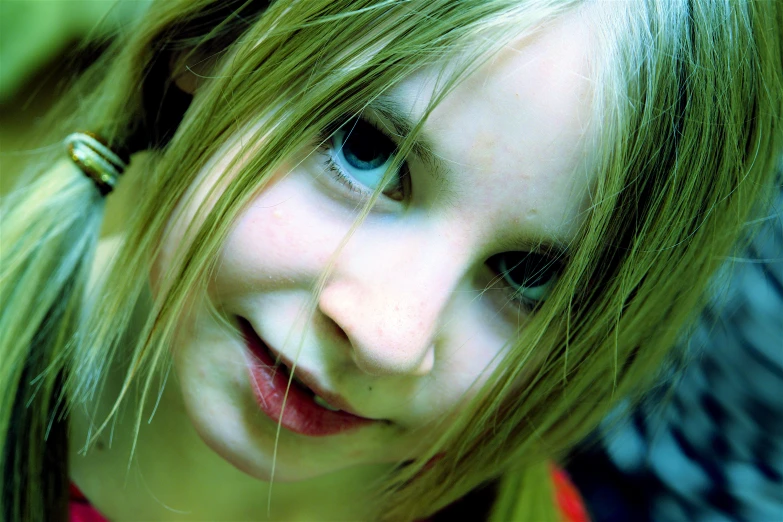 the child smiles brightly as she brushes her hair