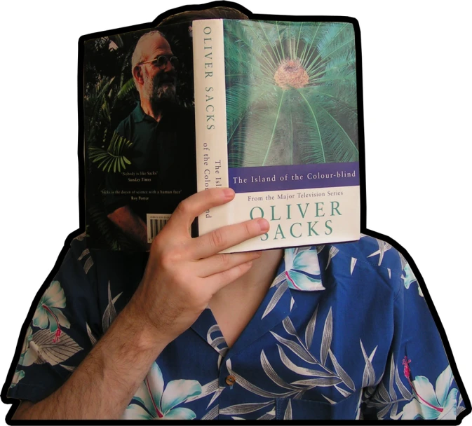 man with an odd head holding up two book covers