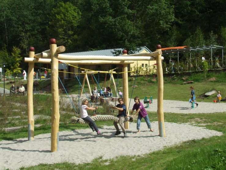children play at the top of a playground