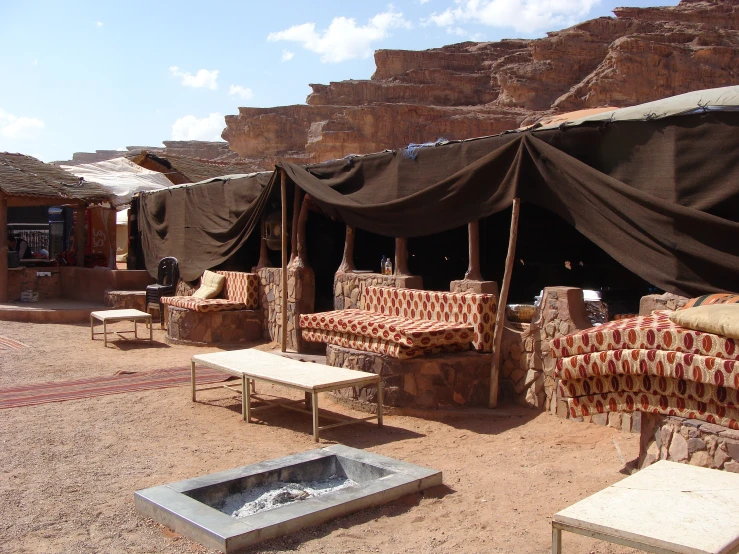 a view of an outside area with many couches