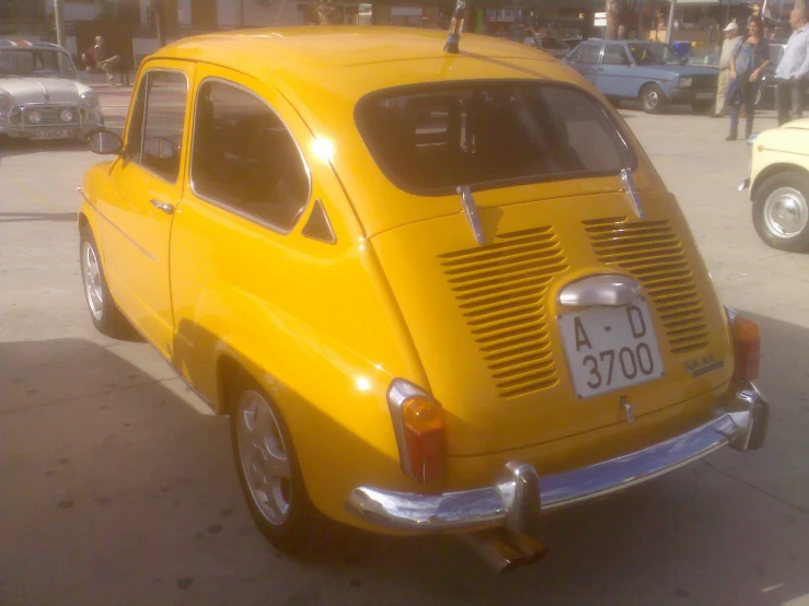 there is an old fashioned car on a street