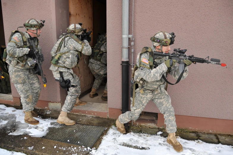 a couple of soldiers walking outside of a building