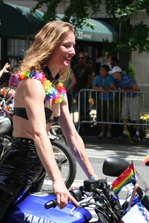 an image of a woman that is standing on a motorcycle