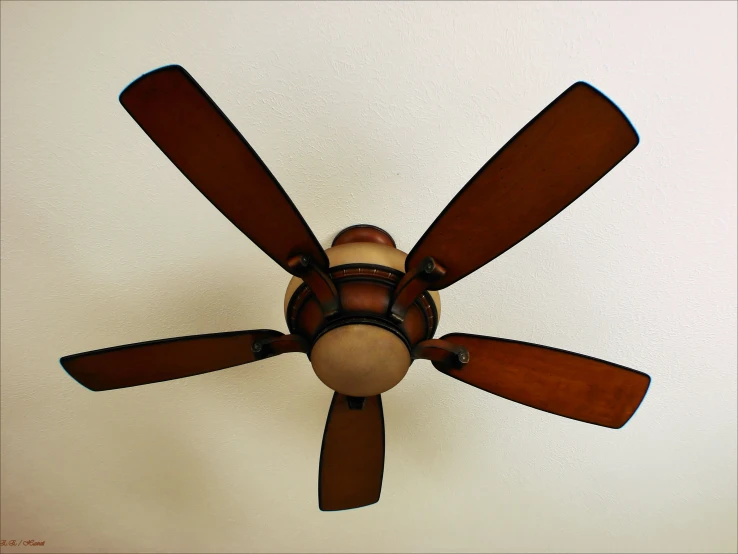 a ceiling fan in the middle of a room