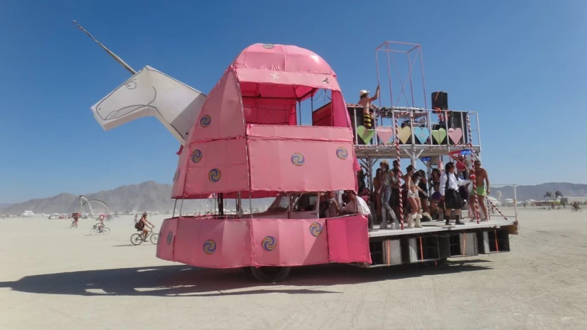 a very large pink structure with many people