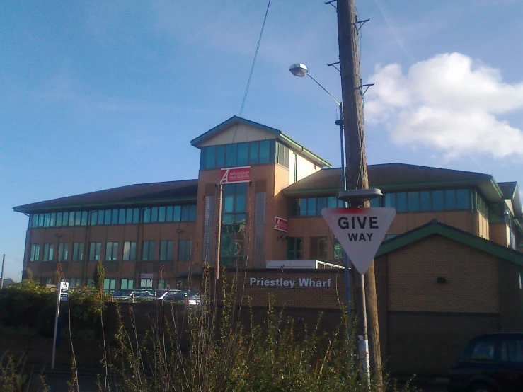 there are several street signs by a building