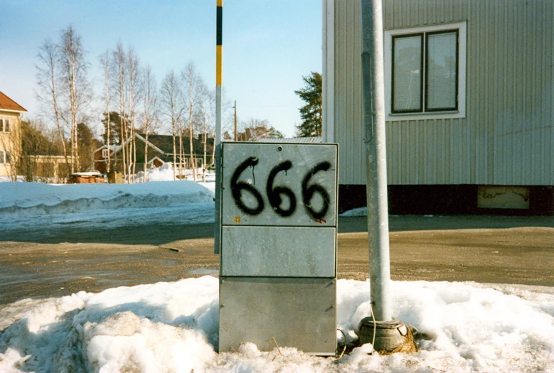 graffiti that reads 666 sitting in the snow