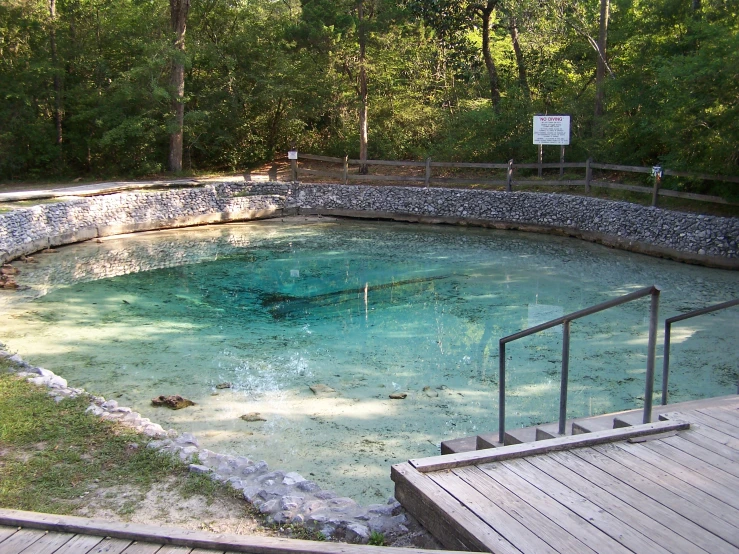 a pool that is next to some stairs