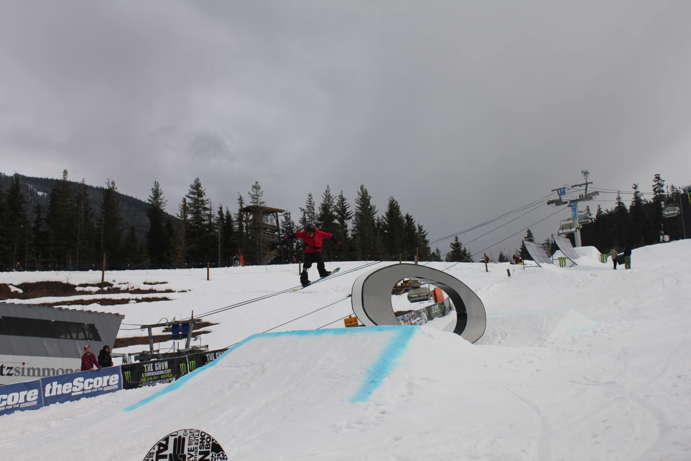 a person flying down a snow covered ski slope