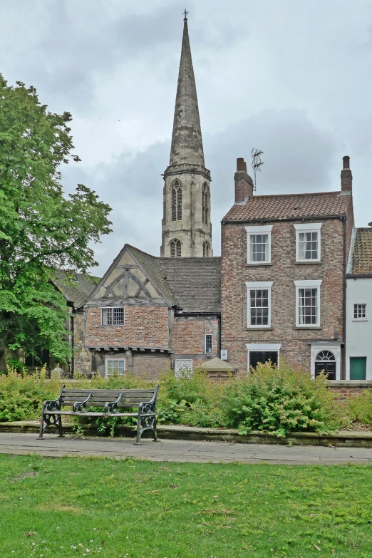 two benches in front of a large building