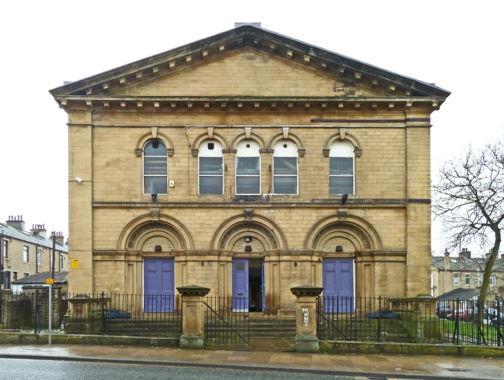 a brick building with some very large windows