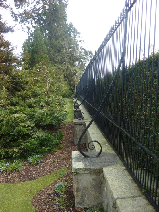 a couple of stones sitting next to a fence