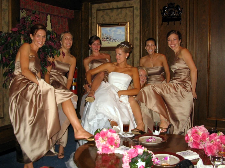 the women are posing together in the wedding party