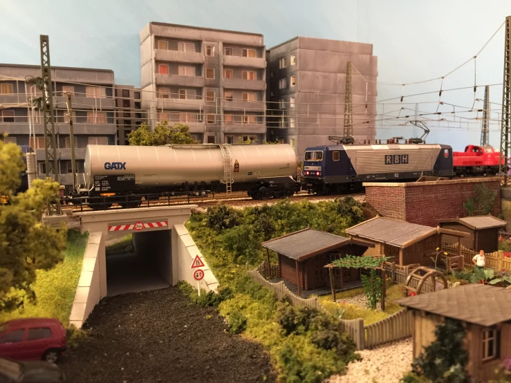 model train scenery with cars and trains