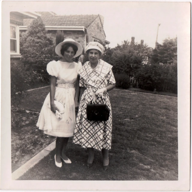 the old fashion picture shows two women posing together