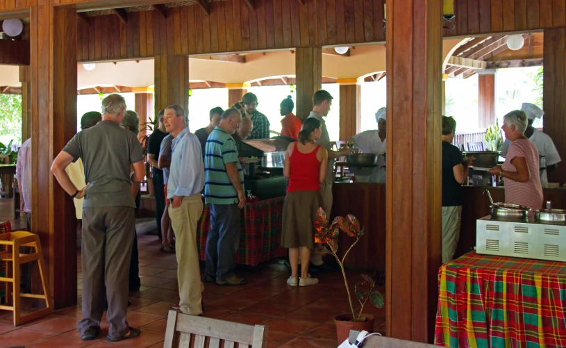 people in a restaurant drinking beverages in front of windows