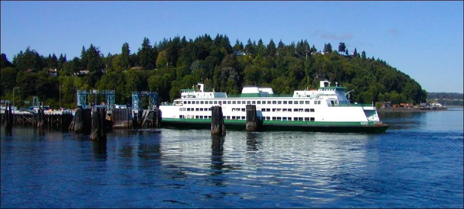 two ferry boats that are sitting in the water