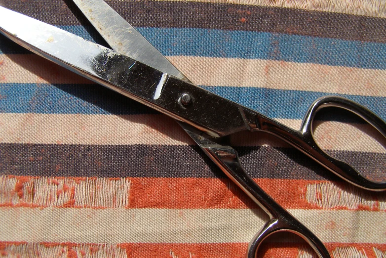 scissors with long blades on a cloth